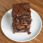 Healthy Greek Yogurt Brownies (Low Sugar & Fudgy) 2 Close-up of moist Greek yogurt brownies with melted chocolate pieces.