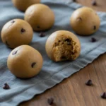 Close up bite revealing creamy interior of protein cookie dough bite