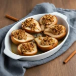 Close-up of honey baked pears with nuts
