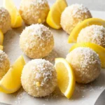 Lemon coconut bliss balls with fresh lemon slices