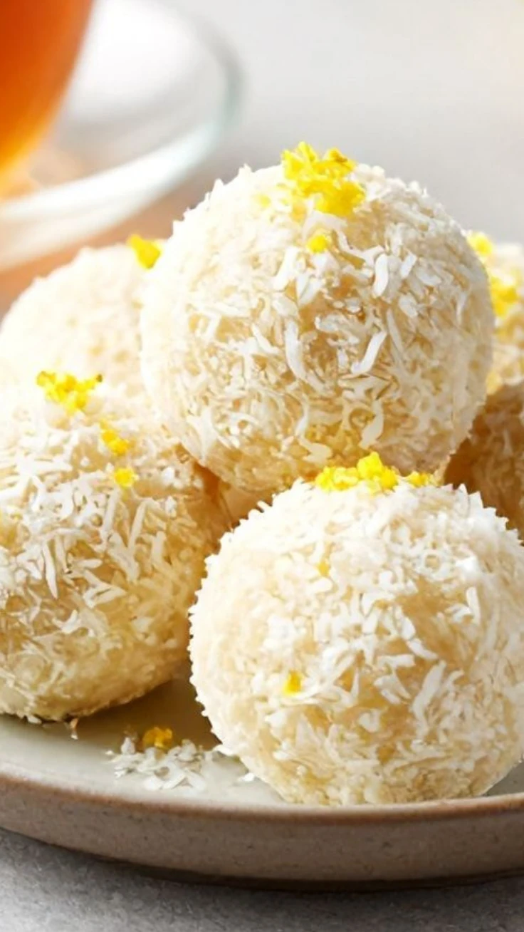 Lemon coconut bliss balls with fresh lemon slices