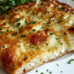 golden cottage cheese flatbread stacked on plate